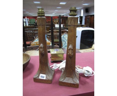 Robert "Mouseman" Thompson of Kilburn Pair of Oak Table Lamps, each with octagonal support, bearing mouse carving, on square 