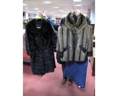 A Ladies Black Mink Coat, single breasted style with rounded collar, 106cms long. A Ladies Raccoon Fur Jacket, with leather t