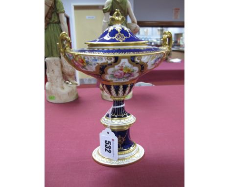A Royal Crown Derby Bone China Pedestal Urn Vase and Cover, of oval section, reserved with panels of delicately painted polyc