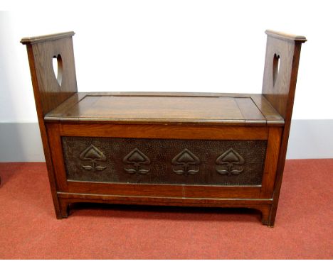 A Late XIX Early XX Century Art Nouveau Blanket Box, with heart shaped supports and hinged lid, over a beaten oxidised metal 