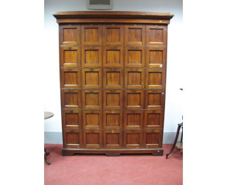 A Mid to Late XIX Century Mahogany Solicitors Cabinet, with stepped cornice and a bank of thirty panelled cupboard doors with