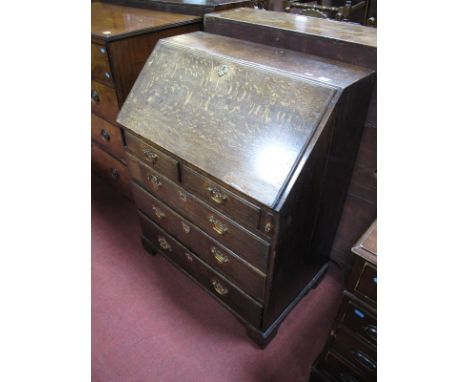 A Late XVIII Century Oak Bureau, with fall front, fitted interior, two small and three long drawers on bracket feet, 102cms h