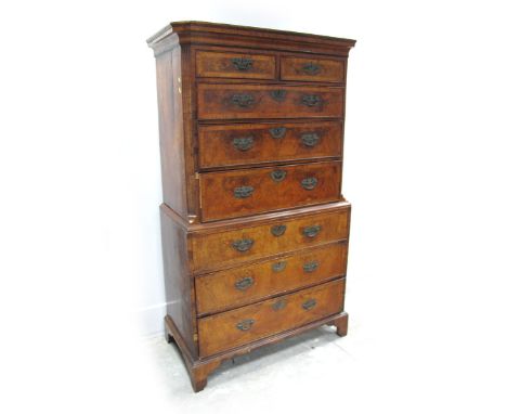 A George II Walnut Chest on Chest, with stepped cornice, the top with crossbanding and featuring two small and three long dra