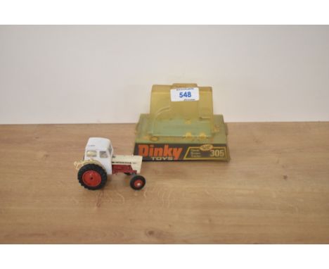 A Dinky die-cast, 305 David Brown Tractor, white body and cab, red engine and hubs, on original bubble card