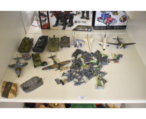 A shelf of Military Die-casts and plastic Figures including Dinky Tanks and Aeroplanes, Britains Figures etc