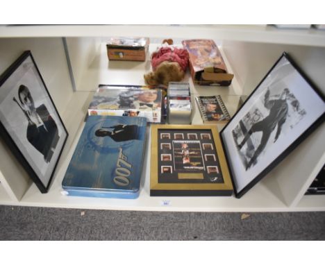 A shelf of 007 James Bond Collectables including Goldfinger Special Edition Film Cell, George Lazenby On Her Majesty's Secret