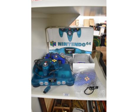 A Nintendo 64 Games Console with three Controllers and power cables along with Games Cartridges, Goldeneye, WrestleMania Lego