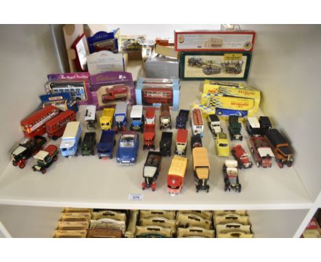 A shelf of modern die-casts including Matchbox KRW-15 The Royal Wedding Bus in original window display box, Matchbox, Lledo a