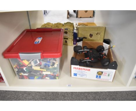 A collection of vintage Lego pieces along with a modern Lego Racers Car with controller