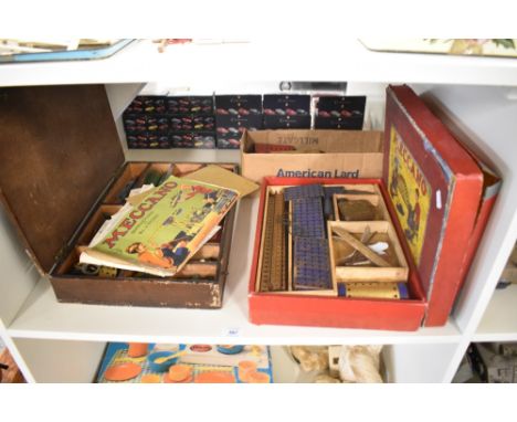 A shelf of vintage Meccano including instructions for No 6 Outfit Set with original box lid, many parts and accessories in tw