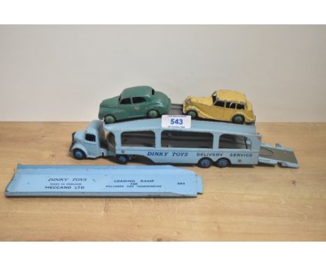A Dinky Toys die-cast, 582 Car Transporter with 994 Loading Ramp along with two Dinky die-cast Cars, Triumph and Morris Minor