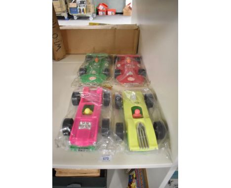 Four Marx made in Hong Kong plastic Flip it Over Racing Cars and Lightning Racer Cars, all in plastic packets