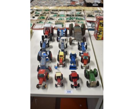 Fourteen playworn Britains, Cresent, Matchbox and similar die-cast, tin plate and plastic Tractors including, Ford, Fordson, 