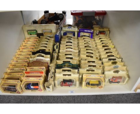 A shelf of Lledo Days Gone and similar die-casts, 80 in total, all in window display boxes