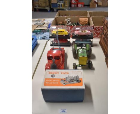 A Dinky Toys die-cast, 561 Blaw Knox Bulldozer in red with cream driver in original box along with a Mettoy Tractor, similar 