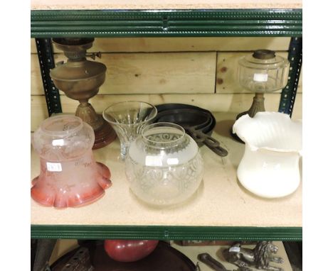 A Victorian brass mounted oil lamp, with an etched cranberry glass shade, with another and a shade, and a set of graduated ca