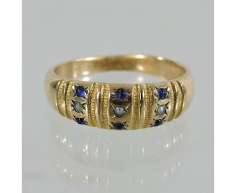 An 18 carat gold sapphire and pearl ring, boxed