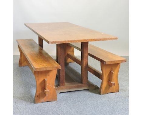 A light oak dining table, 183 x 77cm, together with two benches