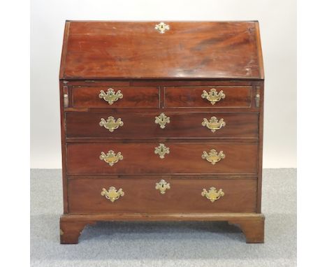 A George III mahogany bureau, on bracket feet, 95cm