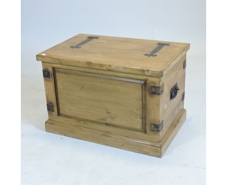 A metal bound pine trunk, with a hinged lid, 66cm