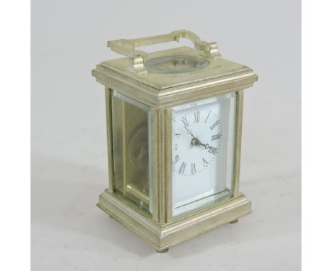 A reproduction miniature carriage clock, 10cm high