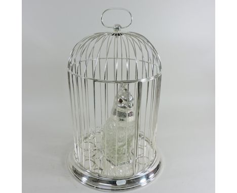A novelty plated decanter set, in the form of a birdcage, 44cm high
