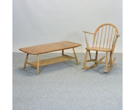 A 1970's Ercol light elm child's rocking chair, together with an Ercol coffee table, 105cm