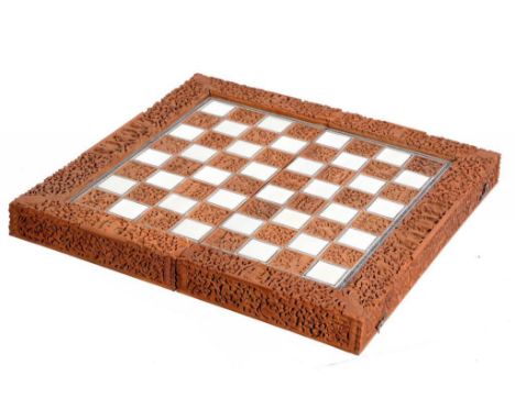  AN ANGLO-INDIAN CARVED SANDALWOOD, IVORY AND SADELI FOLDING GAMES BOARD, LATE 19TH C THE INTERIOR INLAID FOR BACKGAMMON, 44C