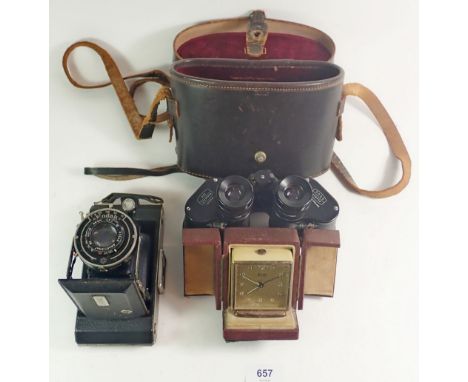 A Kodak Anastigmat camera, Ross binoculars, cased and a Swiza alarm clock 