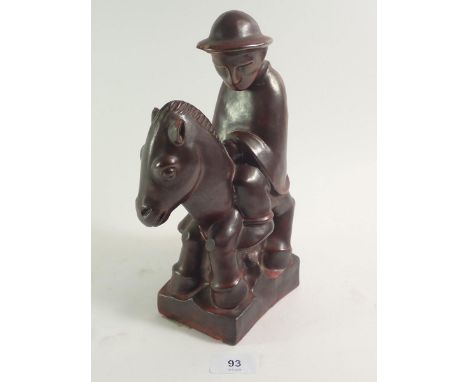A pottery figure of a soldier on horse back by Karls Ruhe-Baden, designed by Ludwig Konig, damaged
