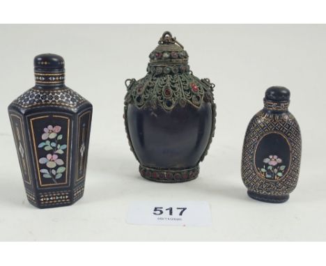 A horn and filigree mounted snuff bottle and two mother of pearl and inlaid lacquer ones 