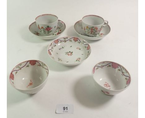 A pair of 18th century English Newhall style porcelain cups and saucers painted flowers (one cup with hairline crack) and a t