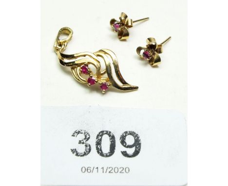 A pair of 9 ct gold and ruby earrings and a matching pendant 