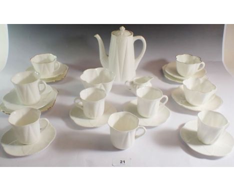 A Shelley white group of tea and coffee ware consisting of coffee pot, three tea plates, three tea cups and saucers, four cof