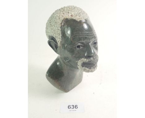 An African stone carved bust of a tribal man signed by O. Musiyawa of the Zimbabwean Shona School, 14cm high. 