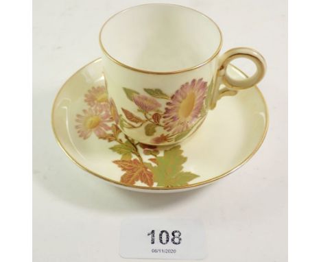 A Royal Worcester coffee cup and saucer painted flowers on a cream ground 'Made for Wright Ray &amp; Co, Detroit' 