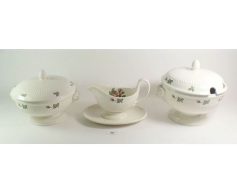 A Wedgwood Moss Rose dinner service comprising: two lidded tureens, vegetable dish, three graduated meat plates, sauce boat, 