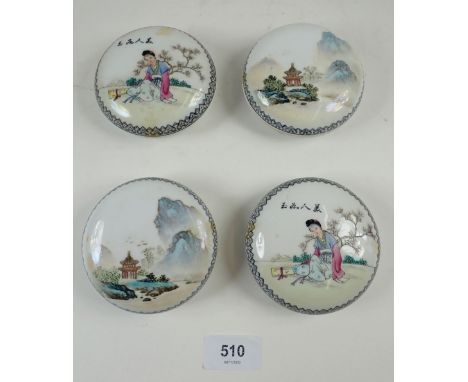 A set of four Chinese circular trinket pots decorated figures and garden scenes, 8.5cm diameter