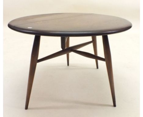 An oak Ercol small circular occasional table with single drop flap and stick supports - 40cm high by 61cm diameter