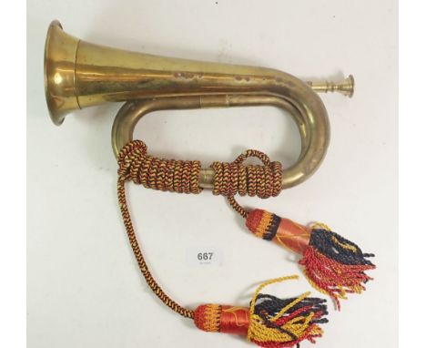 An early to mid 20thC brass military type bugle. 