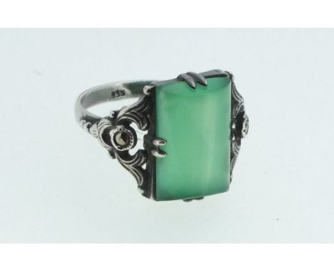 A silver marcasite and jade ring marked 935, size N/O 