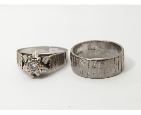18ct white gold wedding band with textured decoration and a matching solitaire diamond ring with central brilliant cut diamon