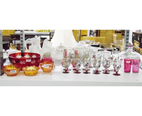 Suite of glasses with enamel overlay with matching lidded storage pots, two cranberry glass-style glasses, a flash glass frui