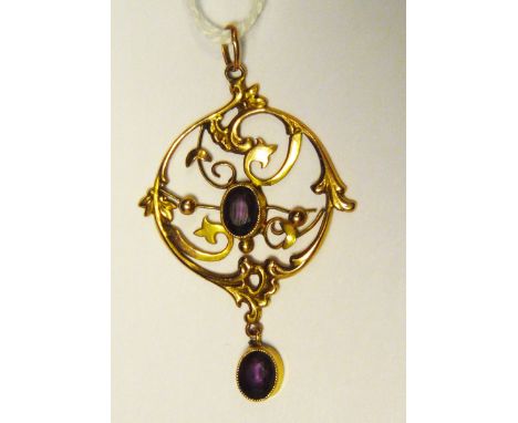 Edwardian 9ct gold and amethyst pendant of circular openwork form of scrolls and beads, set two oval cut amethysts