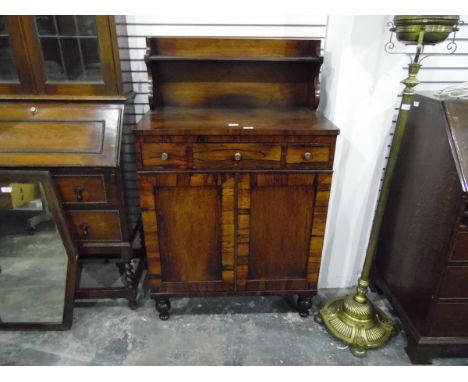 Regency rosewood chiffionier with raised back, fitted three drawers over pair of panel doors and on turned supports, 77cm wid
