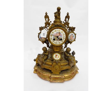 French porcelain and gilt brass mantel clock, the circular painted porcelain dial decorated with Cupid within Roman numerals,