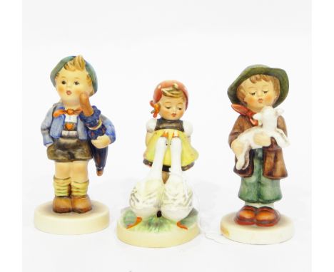 Three various Goebel Hummel figures including boy with pig in basket on his back, boy and lamb and girl with geese (3)    CON