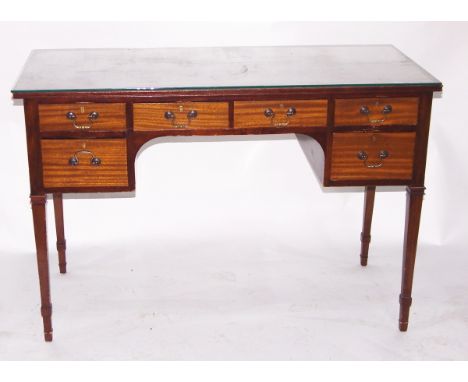 Edwardian mahogany dressing table having an arrangement of six small drawers to kneehole surround and on square tapering supp