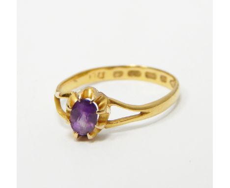 22ct gold amethyst ring set with a central oval mix cut amethyst (misshapen)