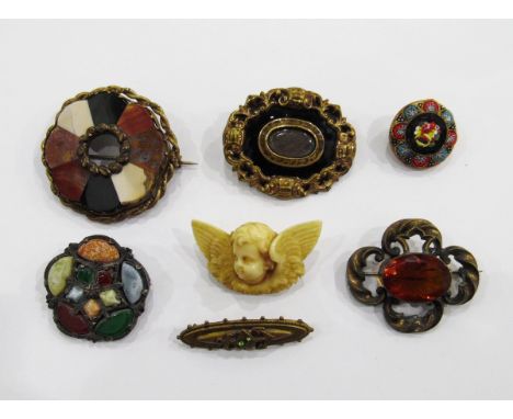 Victorian ivory brooch modelled as a winged cherub's head, a Victorian enamel and pinchbeck memorial brooch (damaged), a Vict